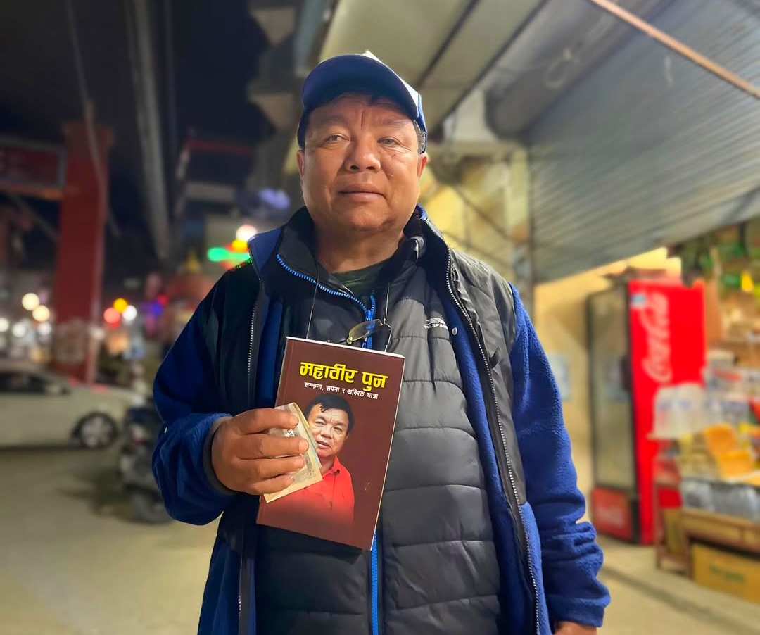 Mahabir Pun selling autobiography book in Pokhara